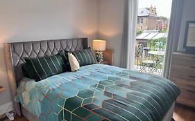 Room With Balcony Overlooking A Garden